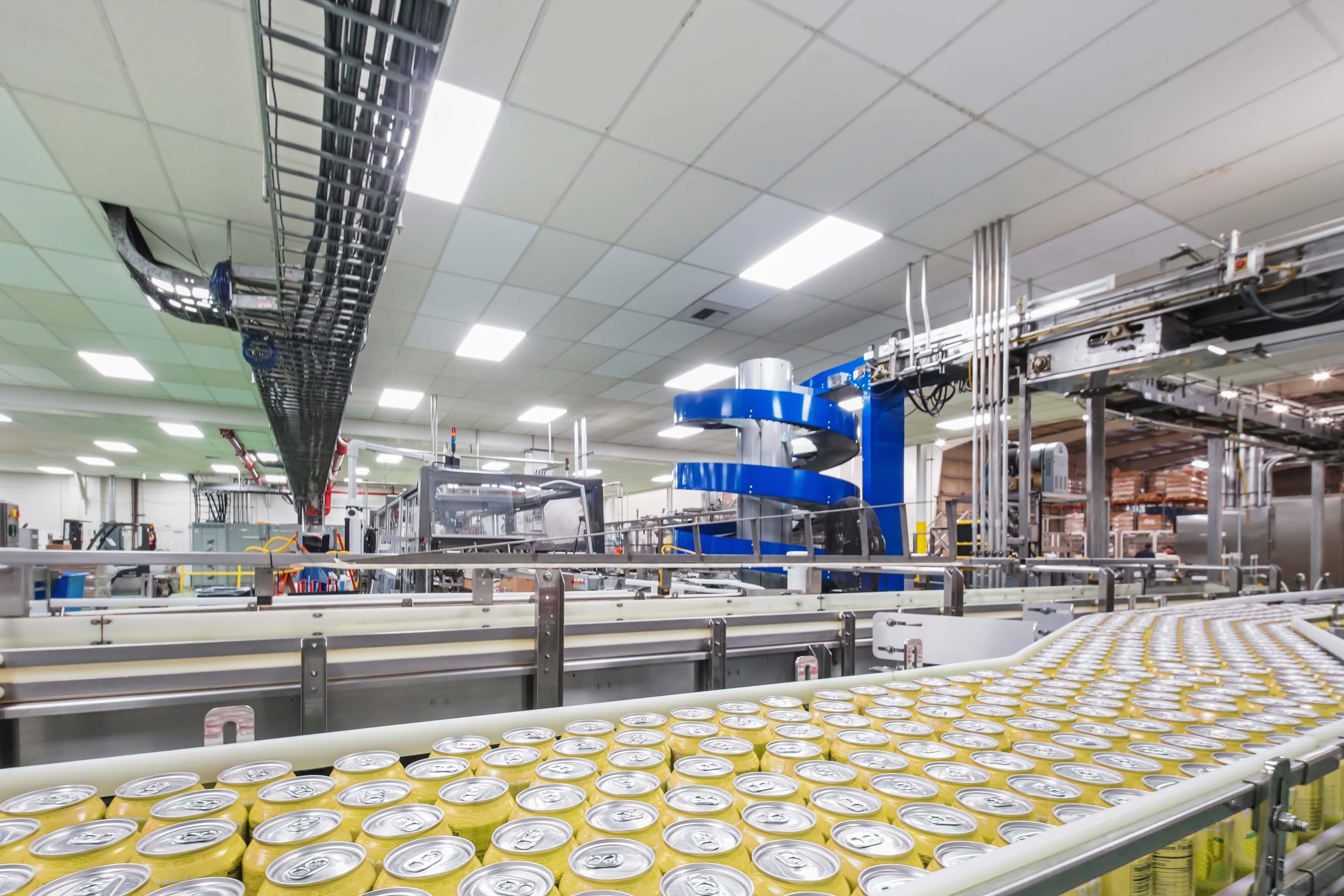 Cans on product line in canning facility